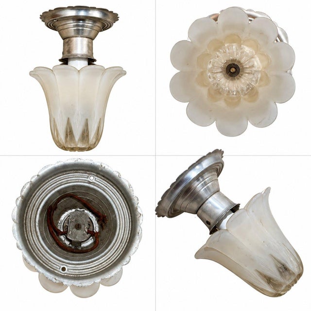 Elegant vintage ceiling light featuring a beautifully sculpted frosted glass shade in a delicate tulip shape and a...