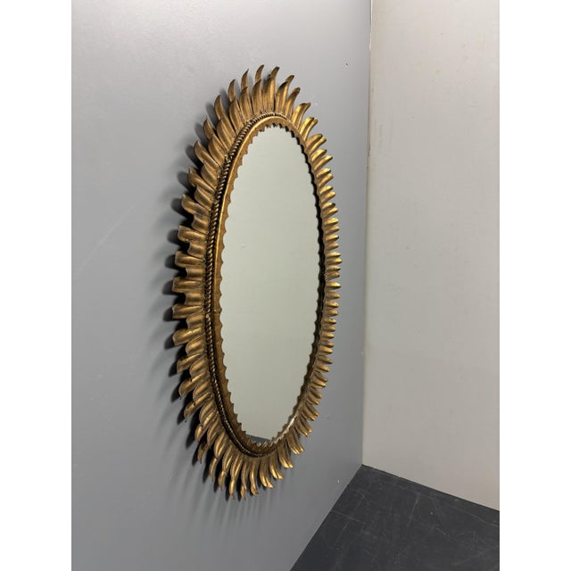 Stunning sunburst mirror often attributed to Italy but as we found this in Spain, most likely from there. The gilt metal...