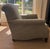 A large club chair with a scroll arm upholstered in Ian Mankin's Arran fabric in the shade "Moss." It was constructed by...