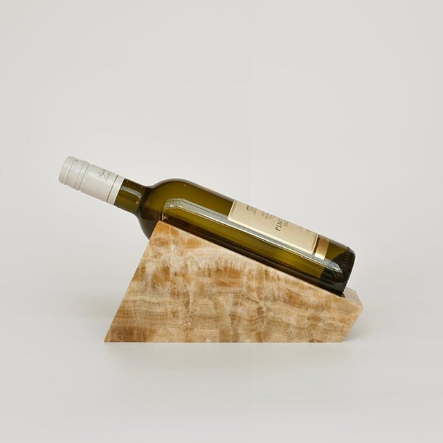 The Onyx Marble Wine Stand holds a single bottle with balance and strength. Its full-stone structure keeps the bottle in...