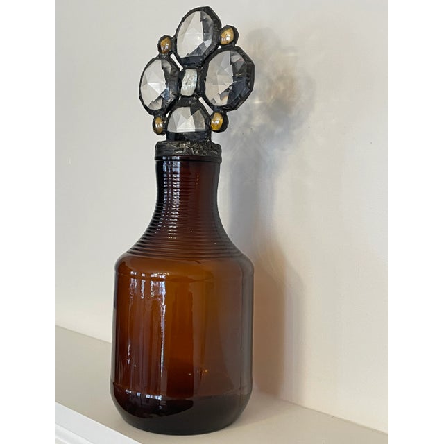 Vintage Amber glass bottle adorned with glass and light amber crystals. Styled in the fashion by glass artist, Karla Walz...