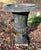 This tall yet slender cast iron garden urn wears the vintage patina of its decades spent gracing a hidden Mendham NJ...
