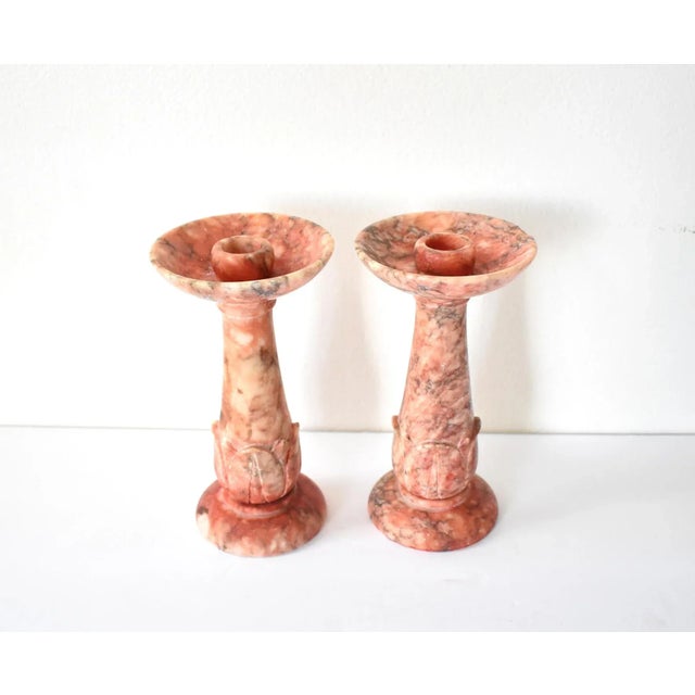 A pair of vintage, mid-century, Italian carved griotte (in French, "cherry", red-pink-cream) marbled candlesticks or...