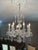 Very traditional and classic cut crystal Austrian chandelier. Eight serpentine crystal arms. Center crystal cross hatch...