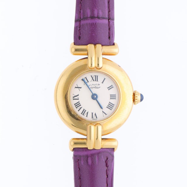 Cartier Must de Colisée Vermeil reference 590002 features a white enamel dial with black Roman numerals and blue sword...