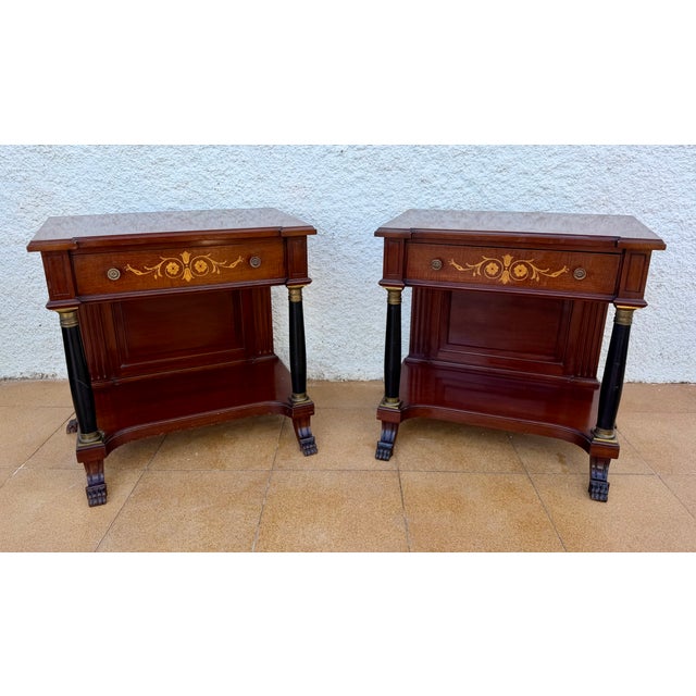Elegant pair of French Empire style nightstands crafted from wood, featuring beautiful floral marquetry decoration and...