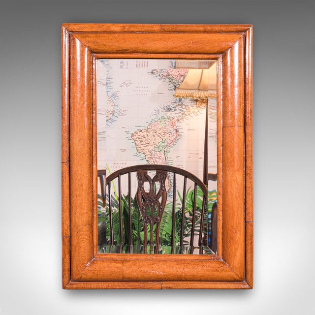 This is an antique reception vanity mirror. An English, walnut and bevelled glass hallway mirror, dating to the Edwardian...