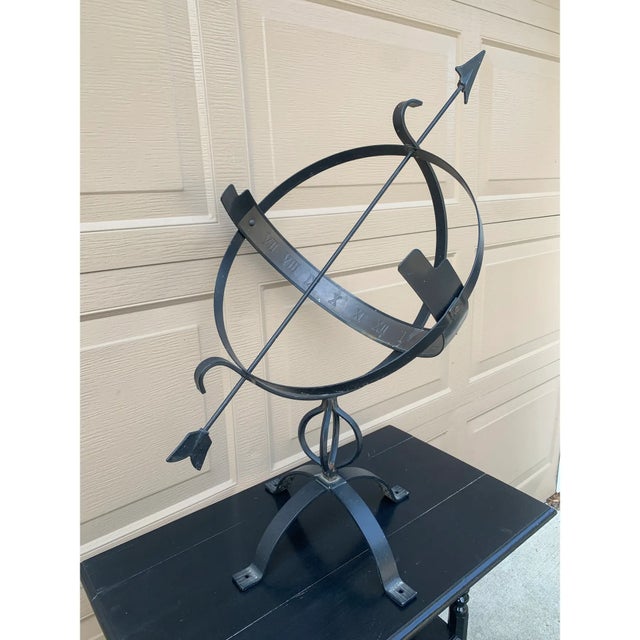 A beautifully crafted iron armillary half-sphere, evoking the timeless elegance of classical European gardens. Pieces like...