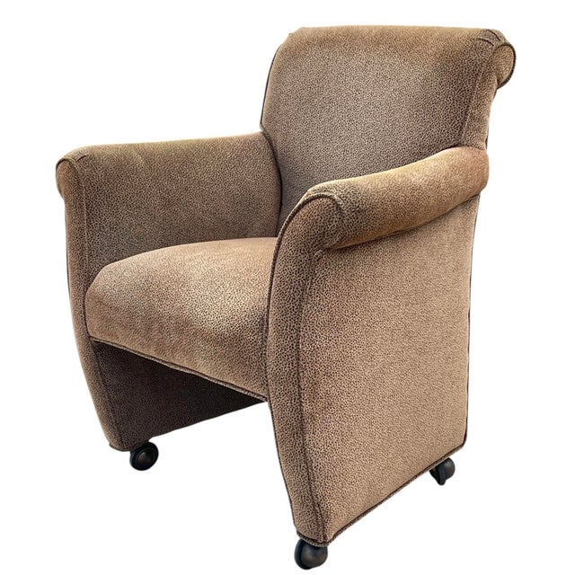 Set of four vintage English-style club chairs featuring a classic rolled arm silhouette and tailored upholstery. Each...