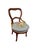 This chair embodies the Victorian Rococo Revival style popular from the 1840s to the 1870s. Crafted from dark...