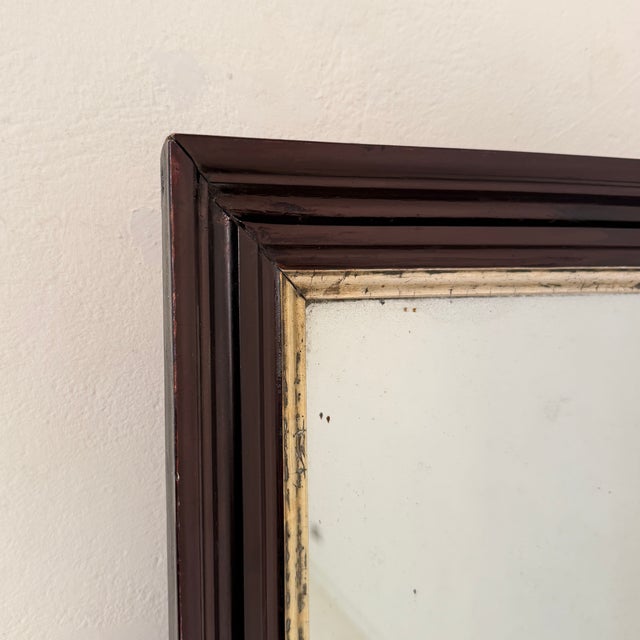 Elegant German wall mirror dating from circa 1870, featuring its original 19th-century mirror plate within a finely molded...