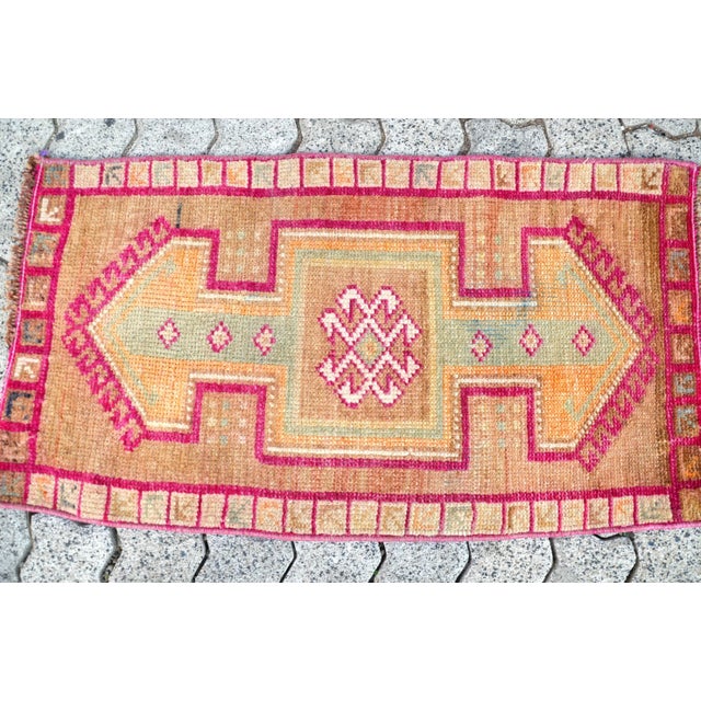 This is a vintage Turkish Oushak rug from the 1960s. The piece was hand-knotted.