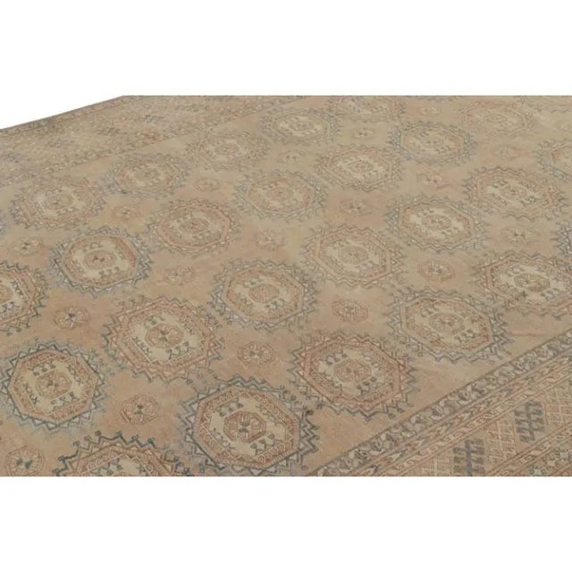 This 8x14 vintage rug is believed to be a rare mid-century Ersari rug, hand-knotted in wool and originating in Turkey...