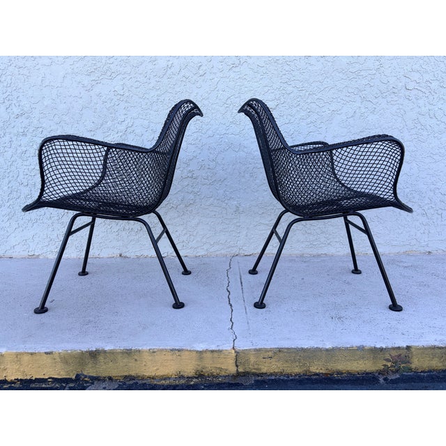 Set of two Russell Woodard designed, Woodard Sculptura dining height arm chairs. Classic Mid Century Modern period garden,...