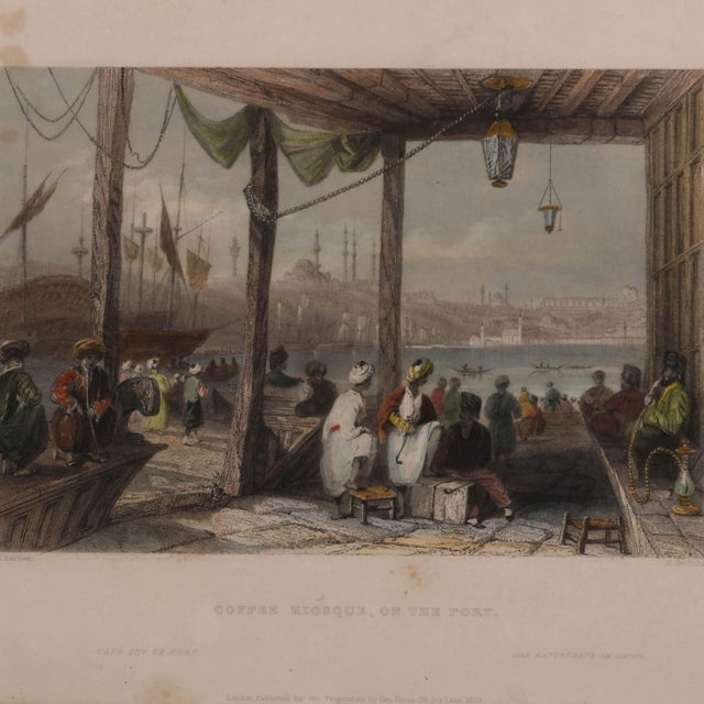 This Antique Hand-Colored "Coffee Kiosque on the Port" Print is a beautifully detailed and atmospheric artwork, capturing...