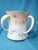 This exquisite late 19th-century vessel by Doulton Burslem (Nile Street, England) features the rare triple-handle...