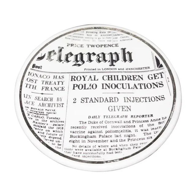 A charming set of porcelain coasters from Bucciarelli Milano. Sold as a set of 6. Decorated with various newspaper...