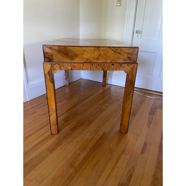 Very chic writing desk with two drawers with campaign style pulls. The olive wood gives it life. The boxy rectangular...