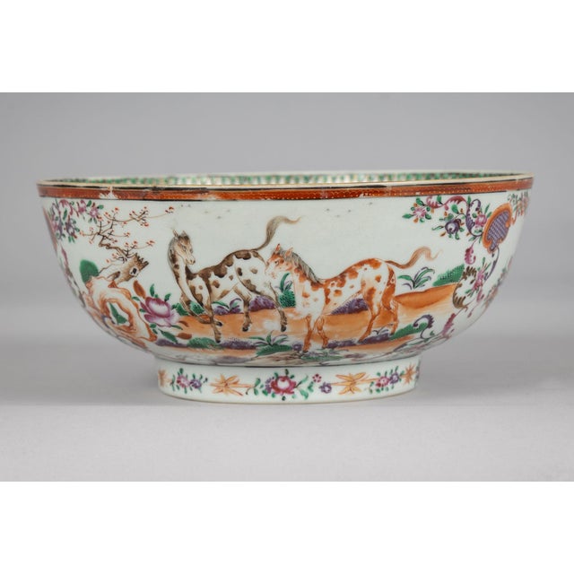 Chinese Qing Dynasty, Qianlong period (1736-1795) Famille Rose bowl decorated with horses, cows, basket of flowers, trees,...