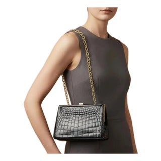 An Elegant 1950s Retro Black Leather and Brass Italian Shoulder Bag For Sale