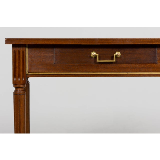 A refined mid-20th century French Louis XVI style writing desk sourced in Provence, France, featuring a rectangular...