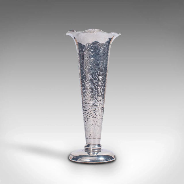 This is a small vintage single stem vase. A Chinese, sterling silver decorative posy flute, dating to the mid 20th...