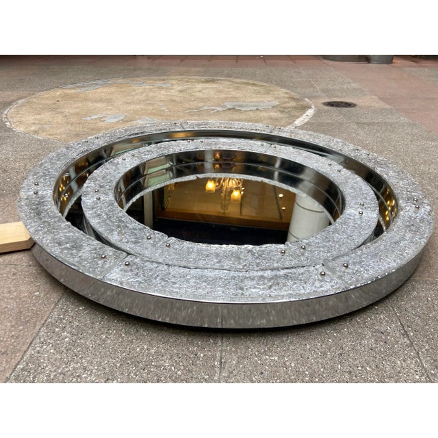 Mirror - Seguso Circa 1960 Murano and stainless steel glass Diameter: 103 cm Depth: 7cm This piece is attributed to the...