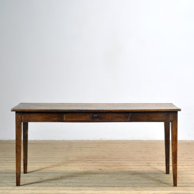 This 19th-century French oak table exudes authenticity, craftsmanship, and timeless elegance. Crafted from solid oak and...