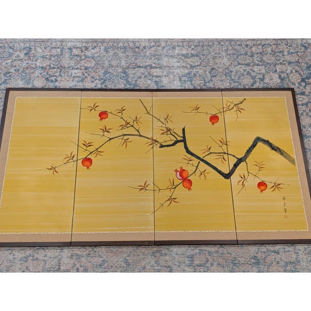 An elegant vintage Japanese Byobu four-panel folding screen acquired in Okinawa during the 1960s. This striking piece...