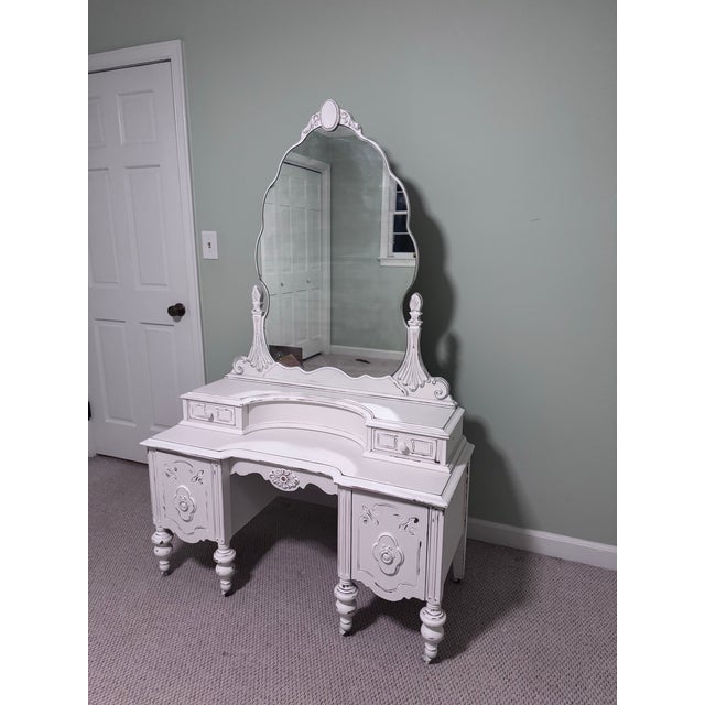 Sweet shabby chic vanity. Four working drawers provide nice storage. Large mirror is perfect for getting ready in front of...