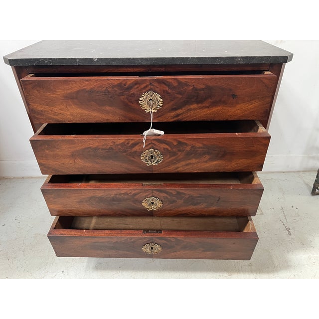 Louis Philippe style mahogany chest of drawers It features four drawers in the front Black veined marble top Good...