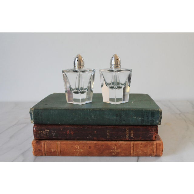 Vintage glass and sterling silver salt & pepper shakers. No chips or cracks.