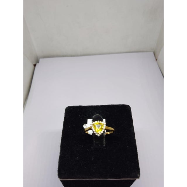Gemstone details Gold Purity: 18K Solid Gold Yellow sapphire: 0.75 cts Diamond: 0.15 cts 18K gold Net weight: 1.9 grams...