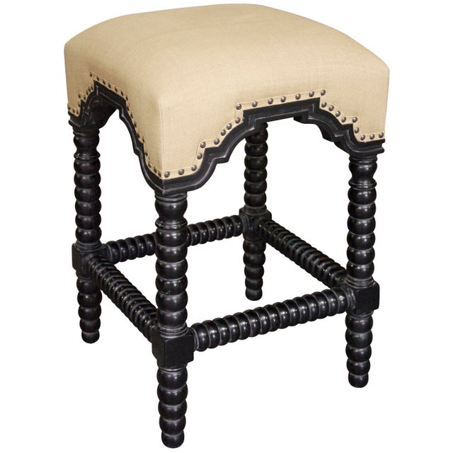 This opulent stool features a plethora of luxe details including ornate bobbin-turned legs and stretchers, and a soft...