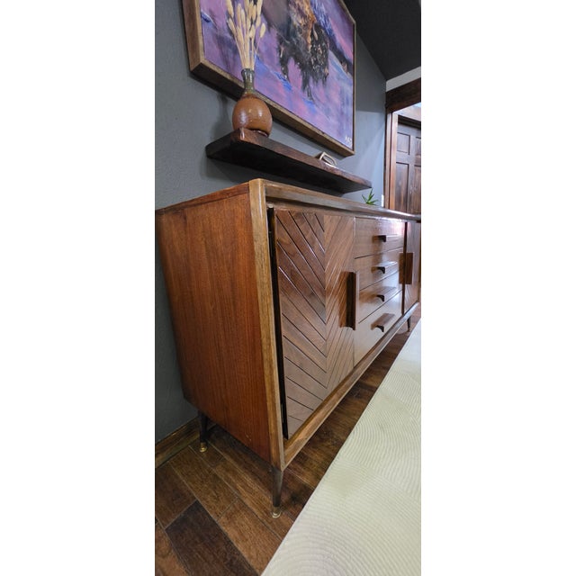 ​The "Legacy Chevron" is a masterpiece of mid-century reimagining from Legacy Artisan Woodworks and Design. This vintage...