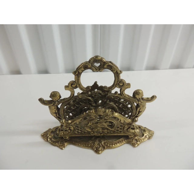 Vintage Brass Cherubs Filigree Letter Holder. With pierced handle. Size; 7.75"W x 5.5"H x 2.75"D.