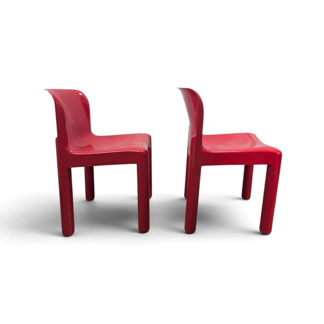 Here is a pair of model 4875 chairs, designed by carlo bartoli for kartell. Made of vibrant red polypropylene, they...