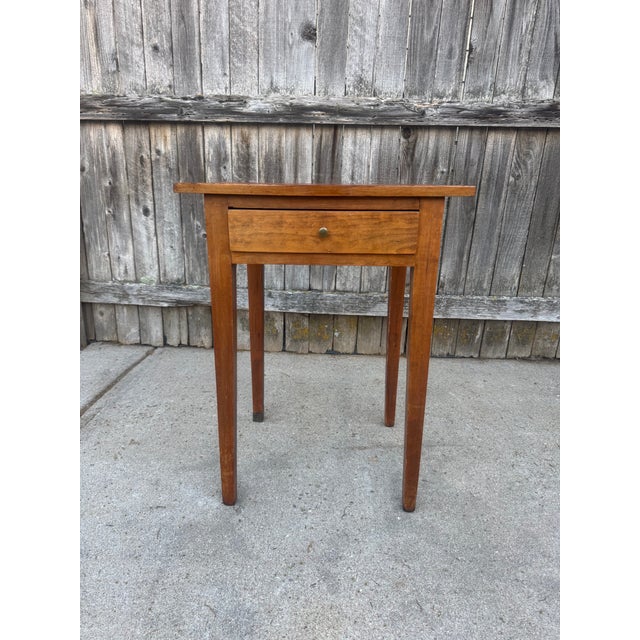 A beautifully proportioned early 19th-century American Federal side table in the Hepplewhite style. Likely cherry with...