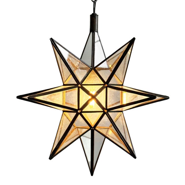 Moravian star lantern with beautiful metal work frame and clear glass inset. Great as a single star or in groupings....