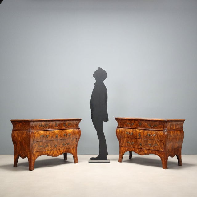 A pair of Lombard 'bombè' chests of drawers from the third quarter of the 18th century, characterized by an elegantly...