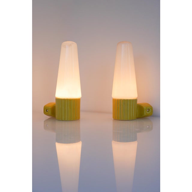 A beautifully preserved pair of mid-century wall sconces designed by hans-agne jakobsson for the iconic swedish lighting...