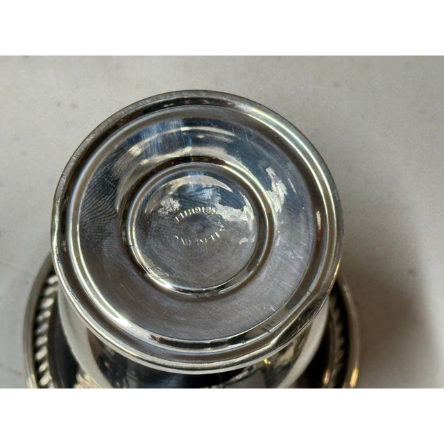 This is an antique sterling silver urn trophy cup. It can be used to hold toothpicks. It has a fabulous detailing on the...