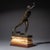 Small bronze sculpture by Max Kruse depicting the Messenger of Marathon, mounted on a profiled marble base in red and...
