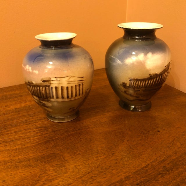 Perfect addition to a bookcase or wall shelf. Pair Of bulbous faces hand painting depicting ancient Grecian ruins....