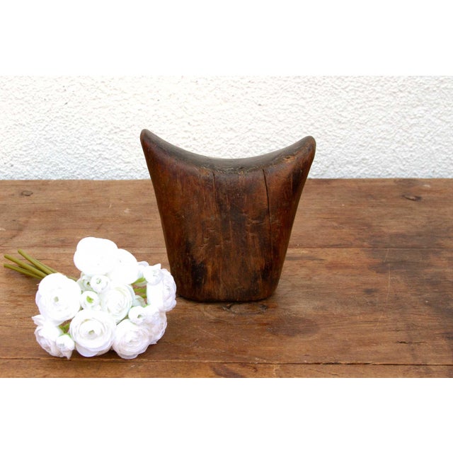 This antique Sidama headrest is more than just a piece of wood; it's a testament to the artistry and traditions of...