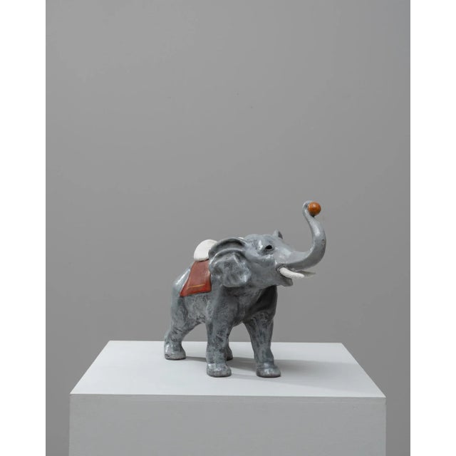 This charming 1960s French elephant figurine is a delightful representation of mid-century decorative art. Crafted from...