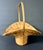 Natural bamboo basket with handle. Approximately 13” x 9” x 14”.