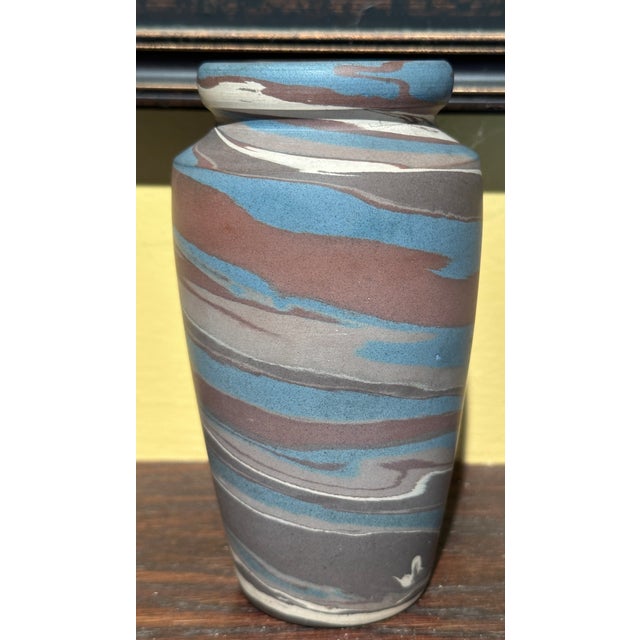 Here we have a Niloak pottery vase with its multicolor swirl design , very good cond with no damage , signed on base , 6"...