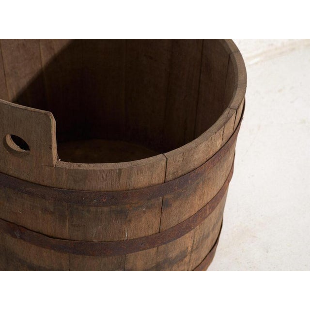 Antique wooden barrel with iron straps, traditional central european cooperage originating from central europe and dated...