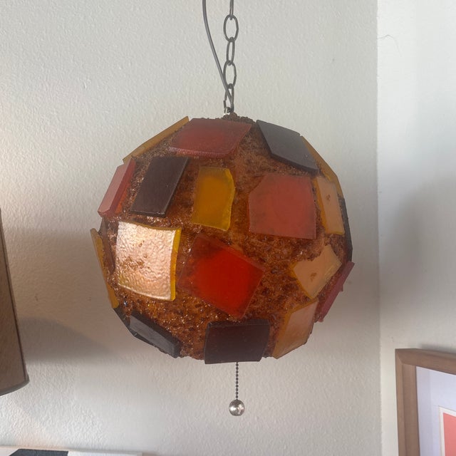 Super cool 1950’s swag lamp with orange and yellow accents. This was purchased from the original owners and has only known...